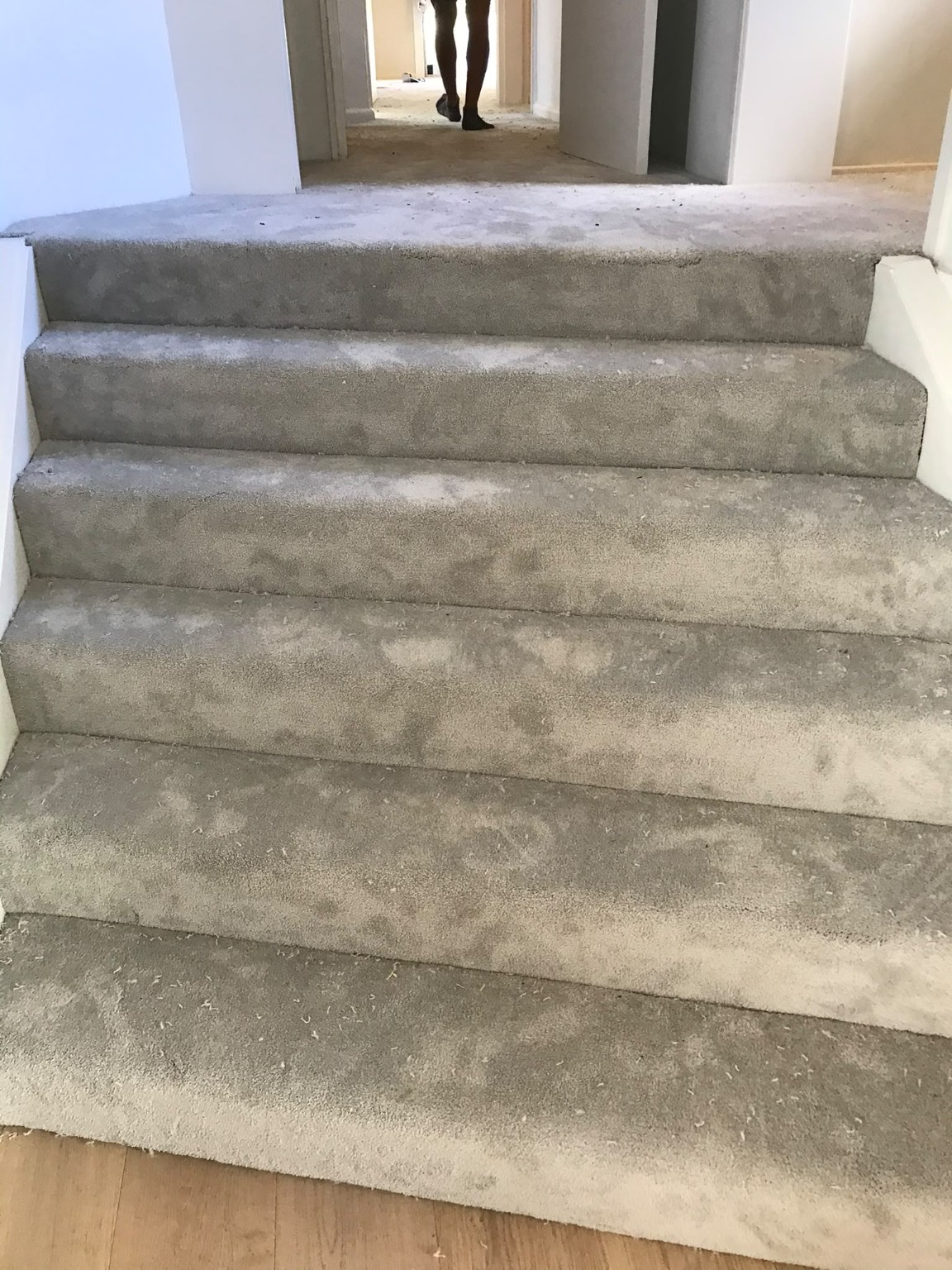 Light grey carpet fitted neatly across a residential staircase